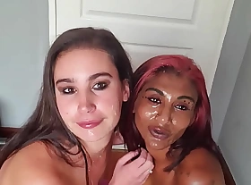 Mixed race LESBIANS covering involving each others stein with SALIVA as well as parceling out sloppy tongue kisses