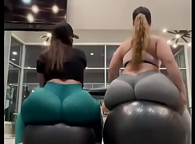 Two PAWGs bouncing it on a gym ball