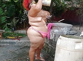 My whore stepmother takes a shower in the patio