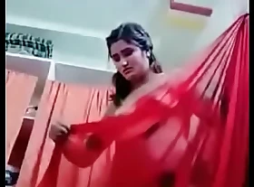 Swathi naidu showing their way body together with wearing red saree